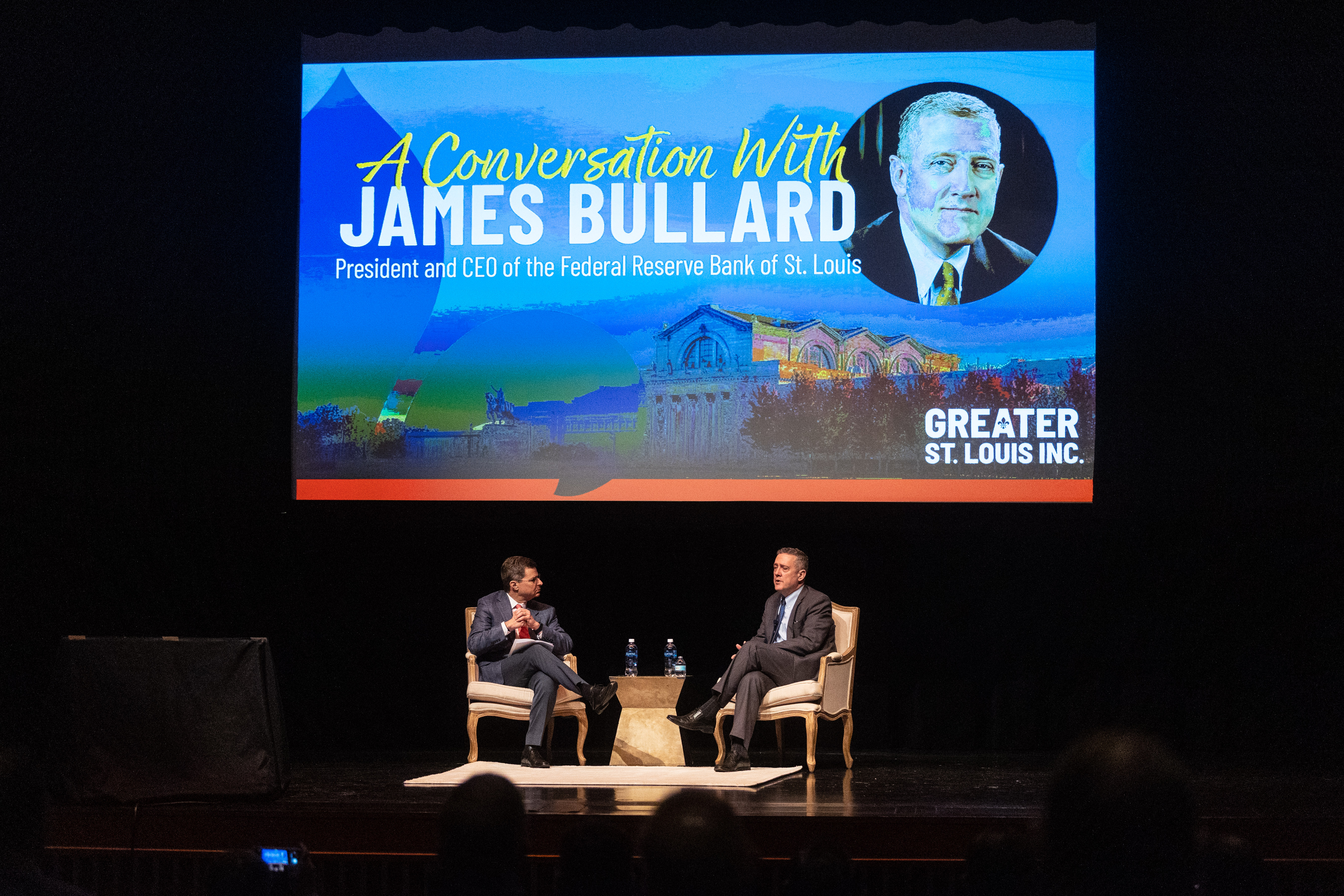 On the stage at the Saint Louis Art Museum, Tim Welsh sits facing James Bullard.