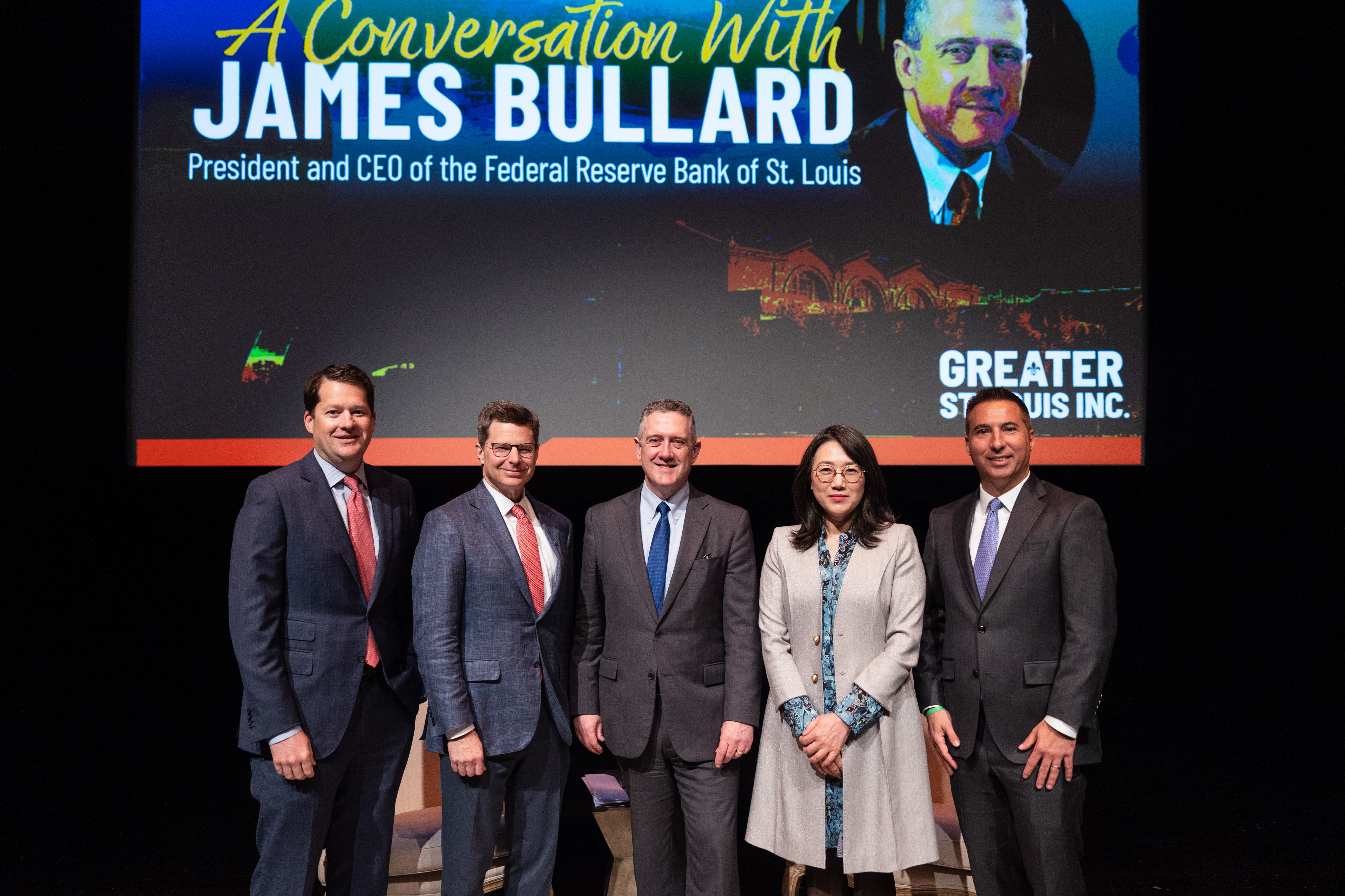 Five civic leaders gather on the Saint Louis Art Museum stage, facing and smiling at the camera.