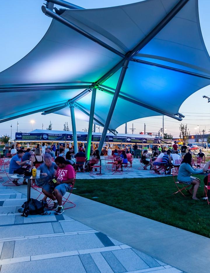 Photo of an outdoor dining area for a food truck park
