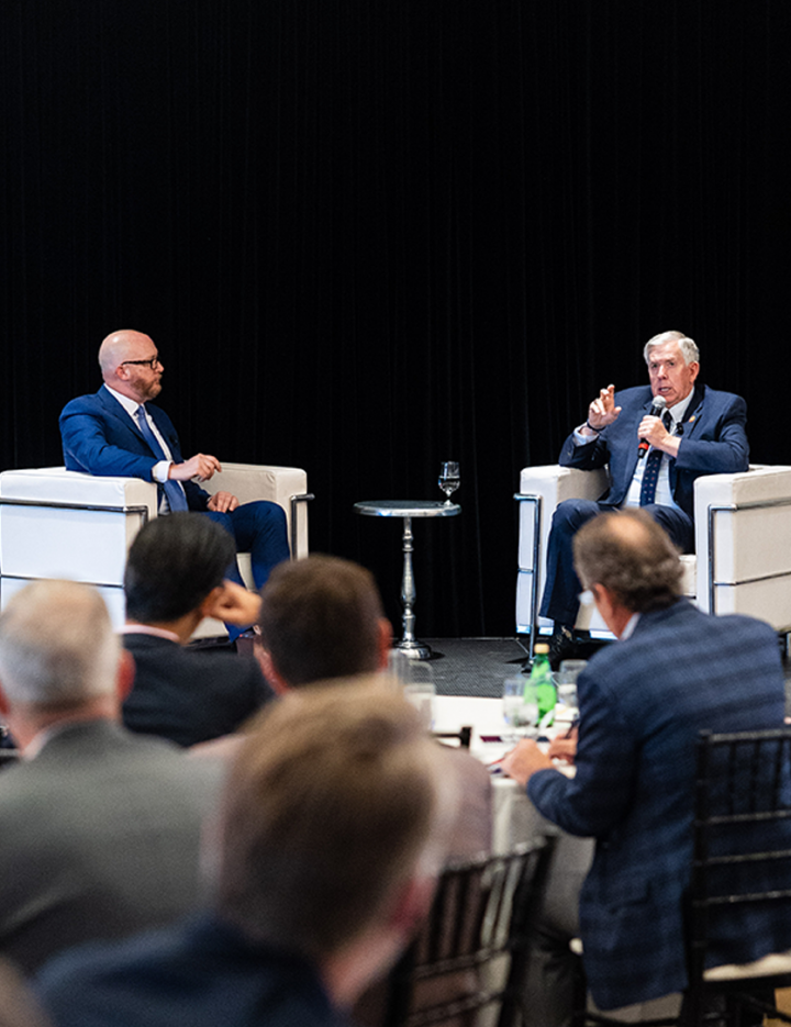 Missouri Governor Parson speaks on a stage at a Greater St. Louis, Inc. investor meeting. Investor meeting.