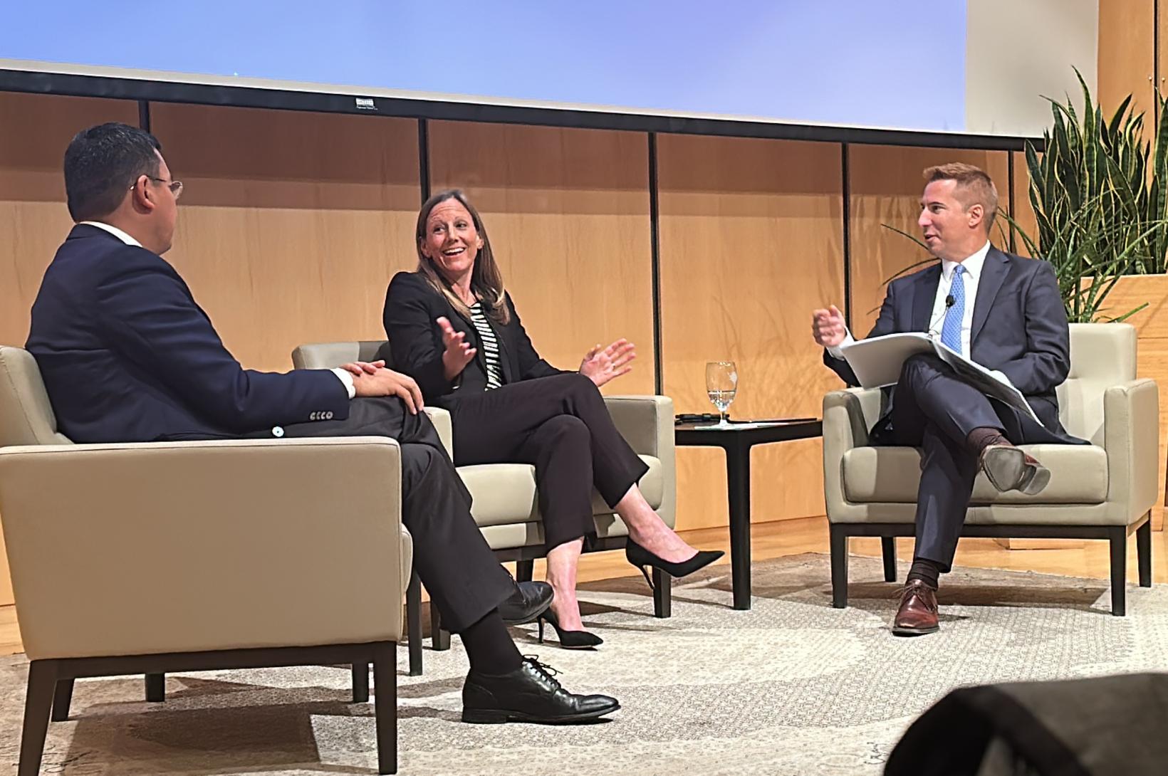 Panel discussion at the Donald Danforth Plant Science Center. Three panelists on stage for a discussion at the Donald Danforth Plant Science Center.