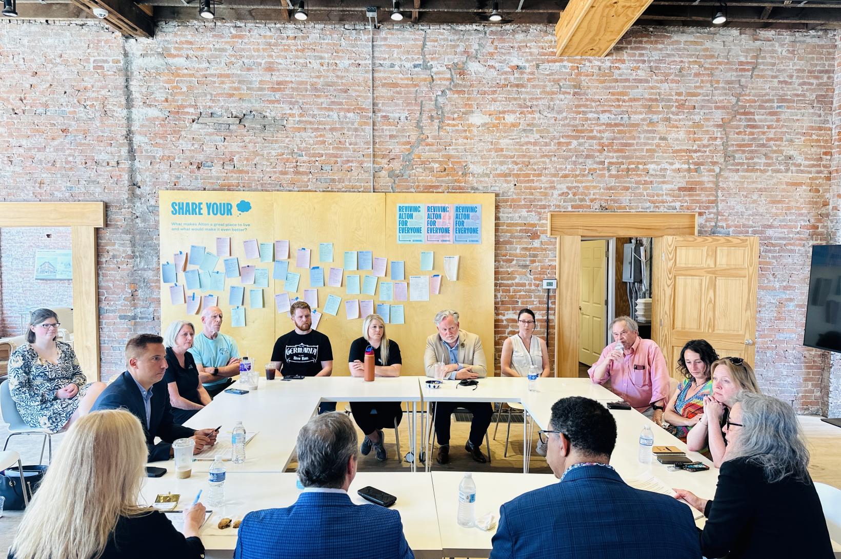 Alton Works Business Roundtable A group of Alton business leaders sits in a roundtable discussion at Alton Works
