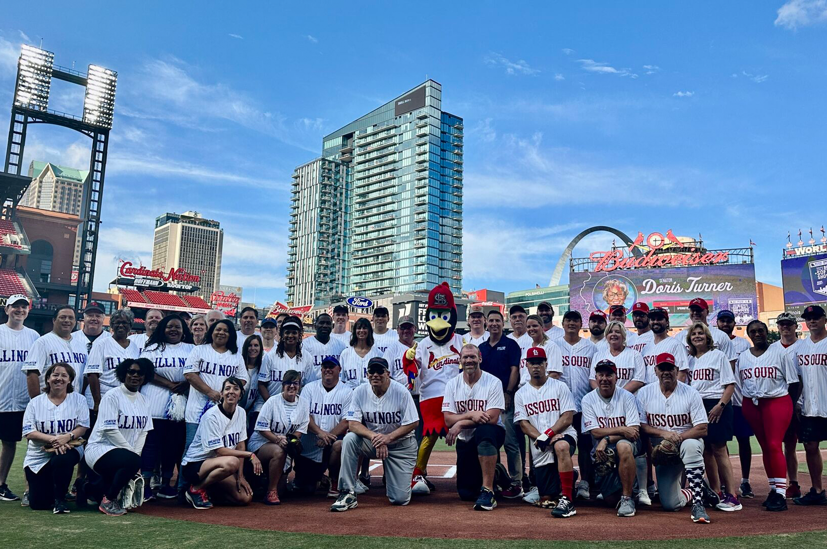 2023 Bi-State Softball Showdown Missouri and Illinois legislatures pose on the field in Busch Stadium during the 2023 Bi-State Softball Showdown