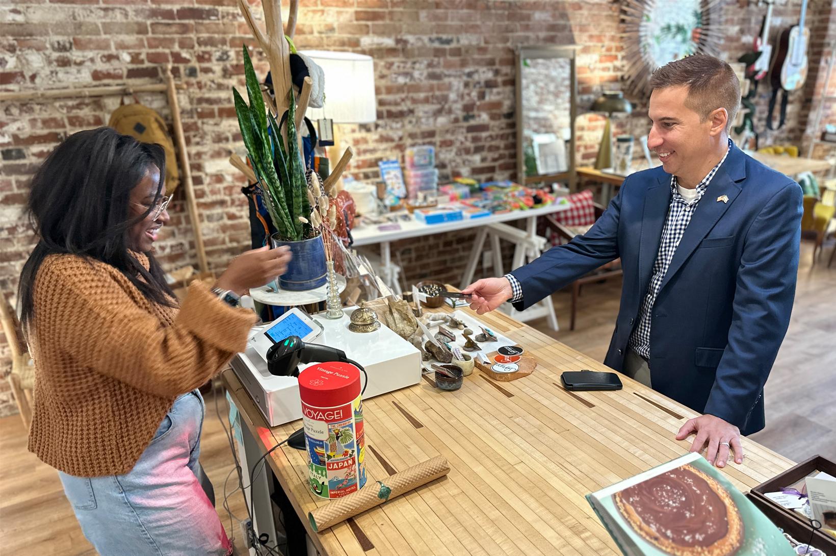 GSL in Greenville, Illinois Jason Hall purchases an item from Spruce Craft + Collective in Greenville, IL.